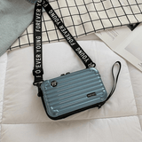 Resväska-inspirerad crossbody-väska