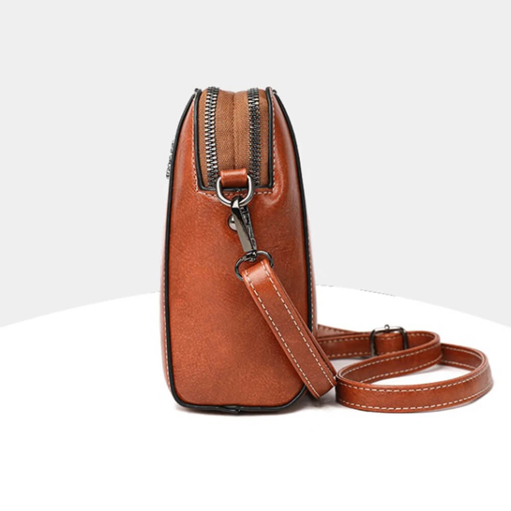 Vintage Crossbody Läderväska för Kvinnor - Justerbar Axelrem, Kompakt Design och Elegant Stil